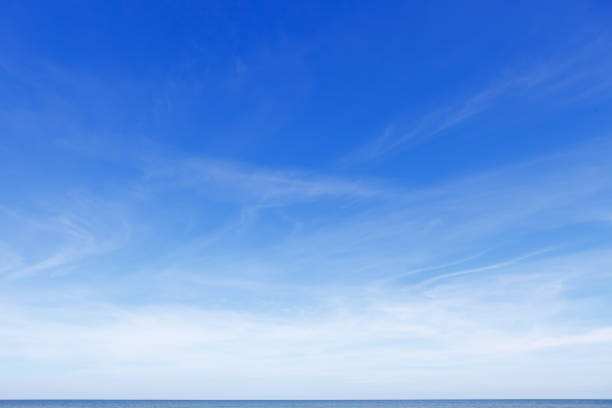 istock Beautiful blue sky over the sea with translucent, white, Cirrus clouds 1308273064