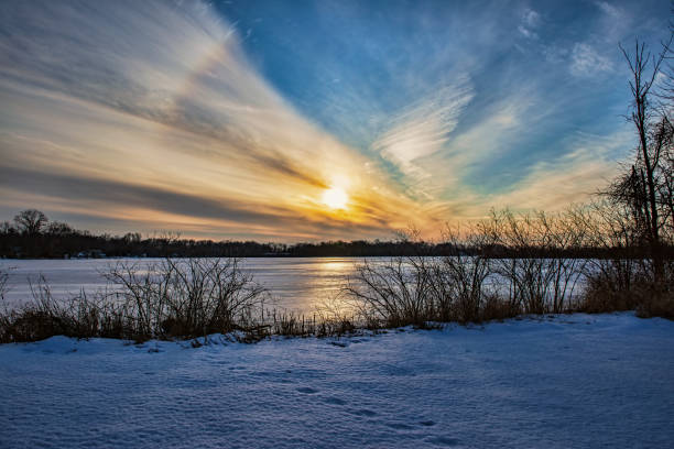 istock Sunset over Frozen Lake 1308273107
