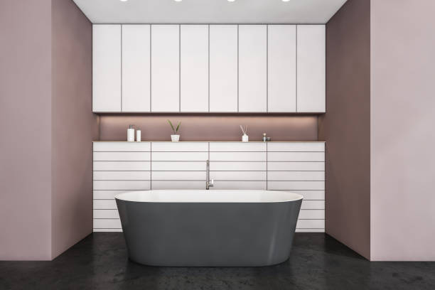 istock Black and pink bathroom with grey bathtub on black marble floor 1308273111
