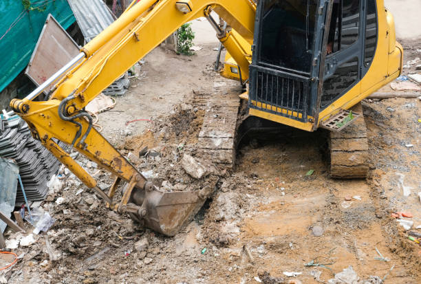 istock yellow excavator or macro truck working in house construction site separate garbage on soil 1308273168