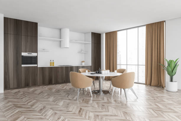 istock Wooden and beige kitchen set with dining table near window with curtains 1308274777