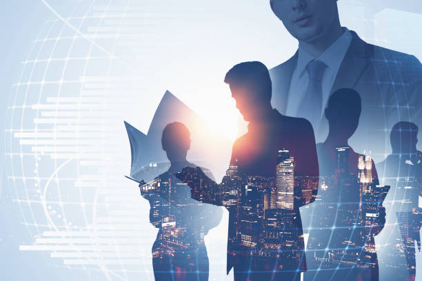 istock Man with folder and his business team in city 1308275616