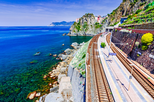 Manarola, Cinque Terre. Train station and Ligurian Sea coastline, Italy travel background.