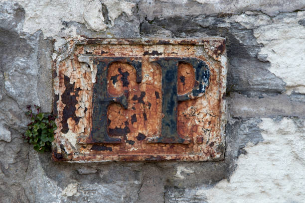 istock Ancient Fire Point Sign on an Old Stone Wall 1308278338