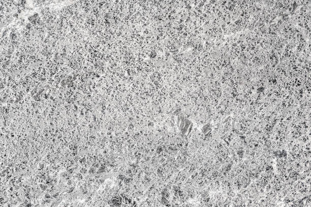 istock Stone Granite Wall, rough texture. Natural background of light gray color 1308279038
