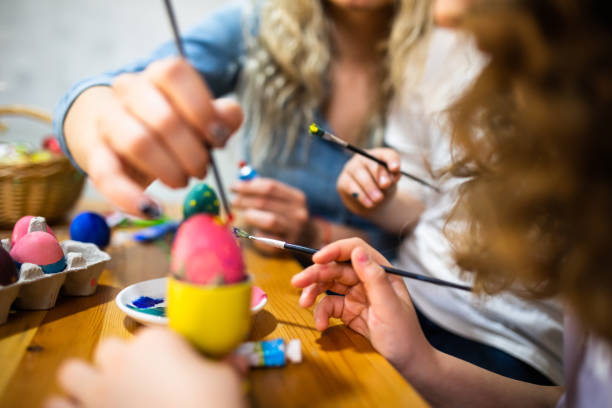 istock A cropped shot of a family decorating Easter eggs 1308279095