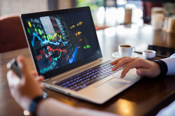 istock Businessman using laptop for analyzing data stock market 1308279116