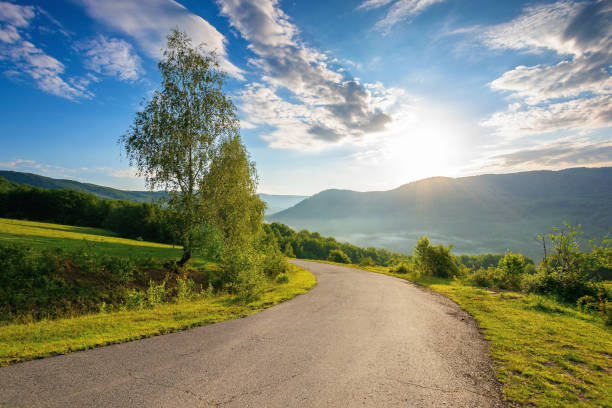 istock countryside road in mountains on a sunny day 1308279247