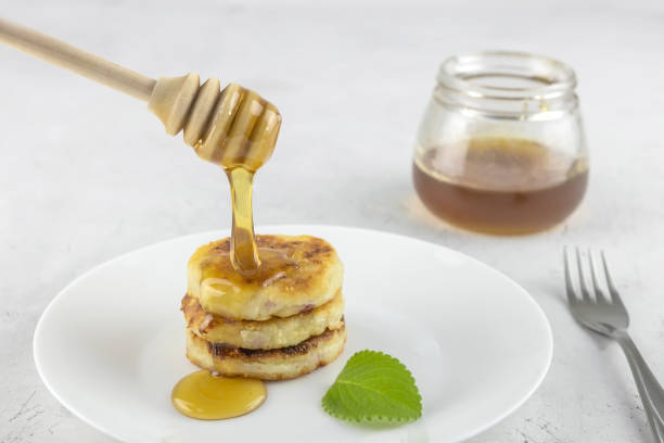 istock fried homemade cheesecakes with honey 1308281048