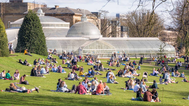 Glasgow's Botanics in spring Glasgow, Scotland - People making the most of sunny weather in spring in the Botanic Gardens, in the city's West End. glasgow scotland stock pictures, royalty-free photos & images