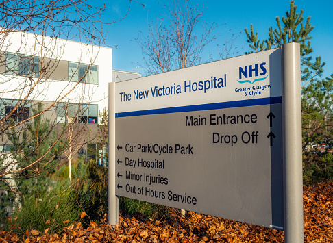 Glasgow, Scotland - A sign directing people to departments of the New Victoria Hospital, located in Glasgow's Southside.