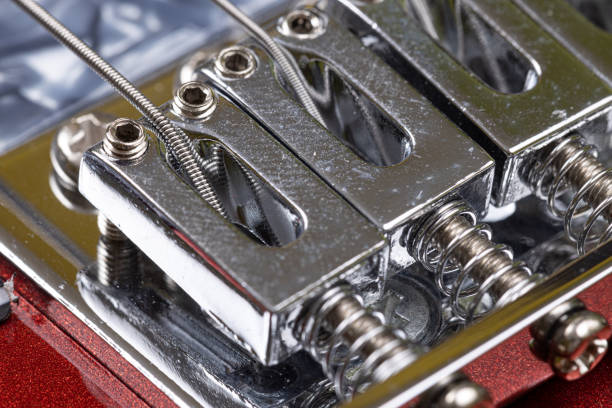 istock Closep of electric guitar bridge with strings 1308284008