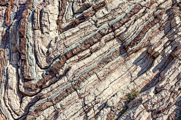 Texture, background layers  in sedimentary limestone rock on cliff face. Texture, background layers  in sedimentary limestone rock on cliff face. South of Crete island. Greece. Europe. metamorphic rock stock pictures, royalty-free photos & images