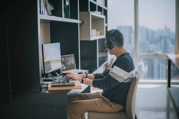 istock asian chinese mature man working from home routine with headset videocall with his colleague coworking 1308286593