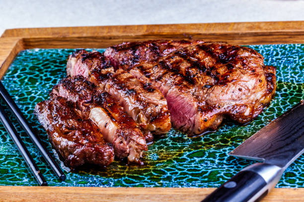 istock Sliced grilled meat steak Rib-eye. Close up 1308287693