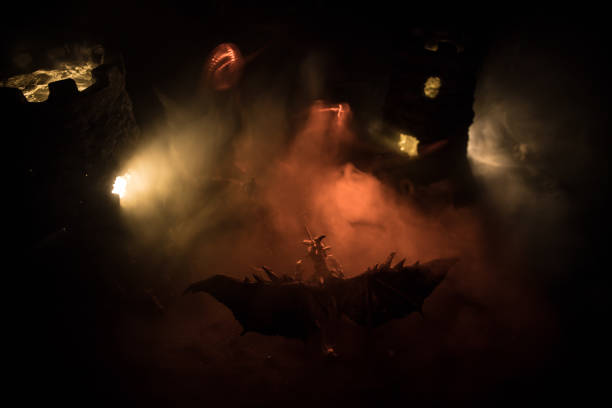 istock Battle between dragon and heroic soldiers. Creative table decoration. Selective focus 1308288076