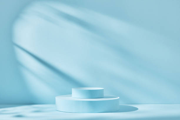 istock Blue background for product presentation with shadows and light. Empty round podiums. Mockup. 1308289269