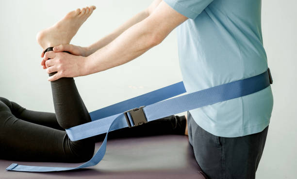 istock Physical therapy treatment using mulligan mobilization belt, joint mobilization and pain treatment 1308291821