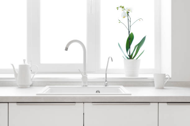 istock Kitchen counter window in pastel colors with sink for dishes 1308291883