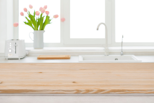 Table top of wood on blurred kitchen sink window background