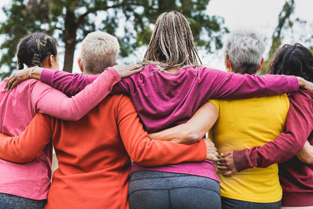 istock Multi generational women hugging each other outdoor - Multiracial people and teamwork concept 1308292079