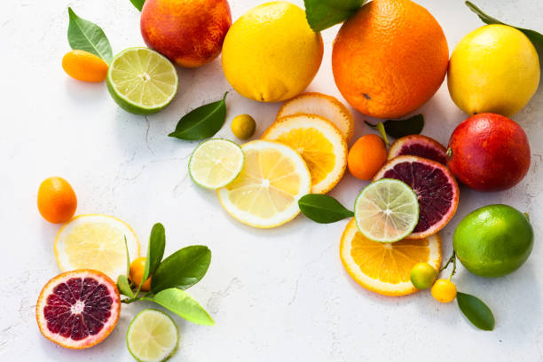istock Assorted fresh citrus fruits with leaves 1308292097
