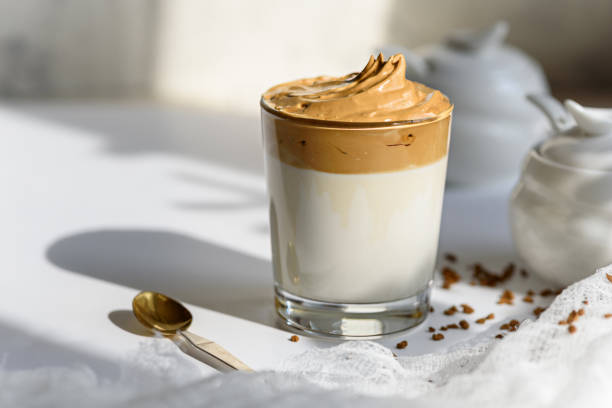 istock dalgona coffee in glass with shadow on white background 1308292461