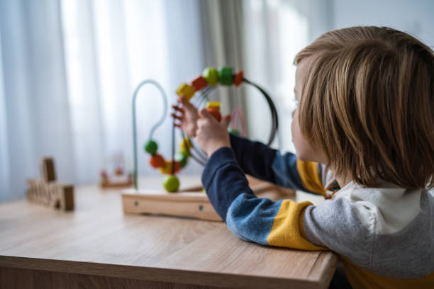 istock Close up boy with wooden toy 1308293963