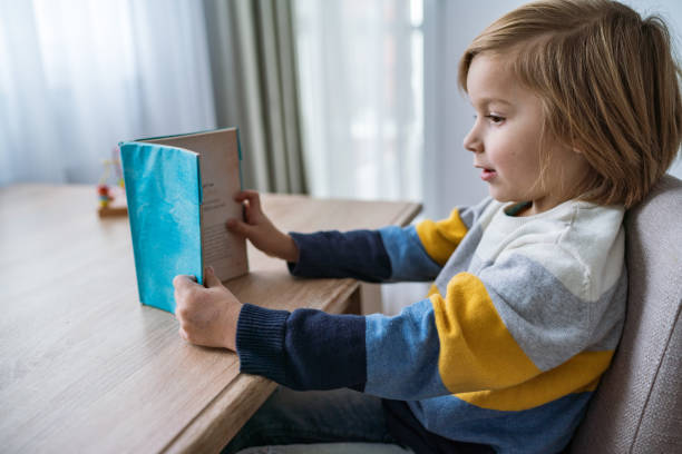 istock Little boy studying at home 1308294695