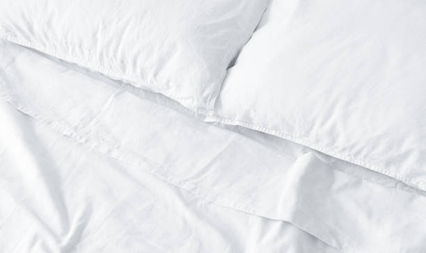 istock Clean White Bedding in a Hotel Room 1308295209