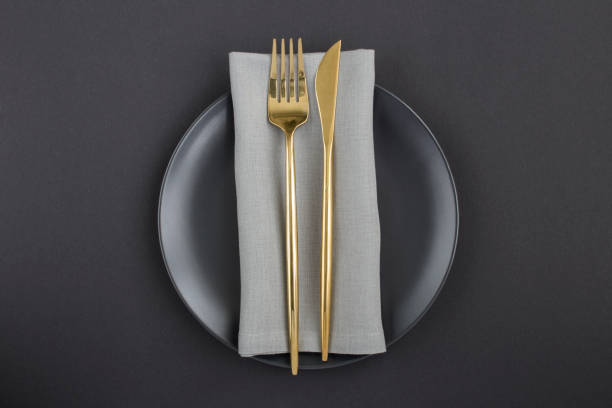istock Top view of festive table setting on the black plate on  the black background 1308295243