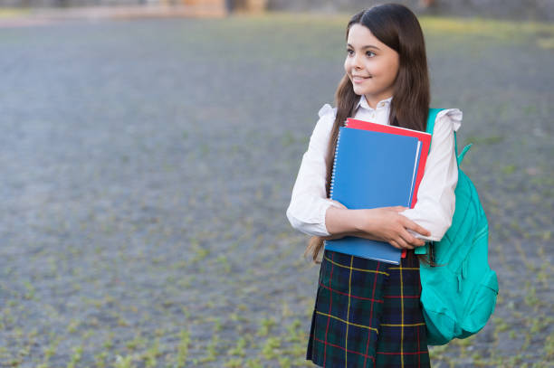 istock Learn to love knowledge. Happy child back to school. Knowledge day. September 1. School and education. Knowledge and reading books. Knowledge comes from learning, copy space 1308296558