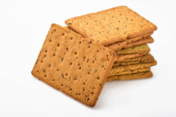 istock Cracker with flax seeds and oat bran rectangular shape for healthy, dietary and balanced diet isolated on white background. Snack for proper nutrition 1308297297
