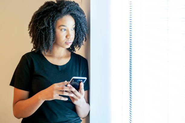 istock Woman in the office beside a window 1308297735