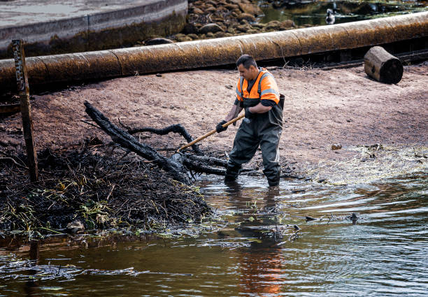 Annual clean-up city Odense River near Munkemose in city Odense on the island of Funen, Denmark