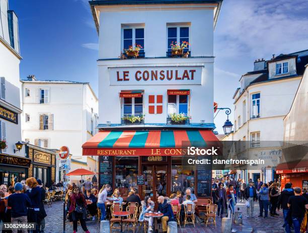 People Sitting Outside Restaurant Le Consulat At Montmartre Paris Stock Photo - Download Image Now