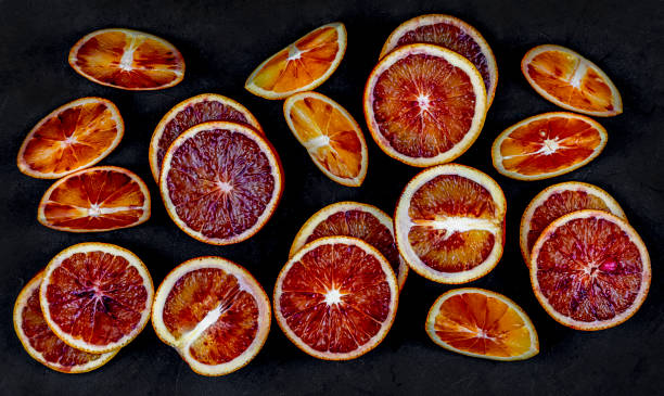 istock Close-up of Fresh red Orange Citrus fruit composition on black background. 1308298951