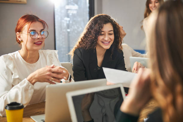 istock Cheerful business colleagues working on project in office 1308298967