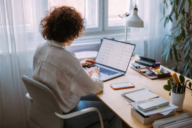 istock Anonymous Businesswoman Working from Home during Lockdown 1308299174