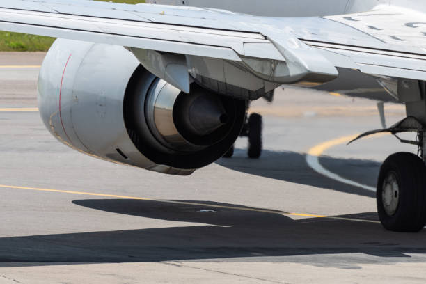 Airplane at the international airport Turbofan jet engine under the wing of a modern narrow-body passenger aircraft. peritoneal dialysis stock pictures, royalty-free photos & images