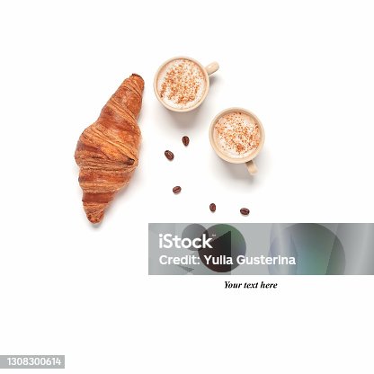 istock Cups of coffee and fresh croissant isolated on white background. Breakfast concept. Creative layout. Top view, copy space. 1308300614