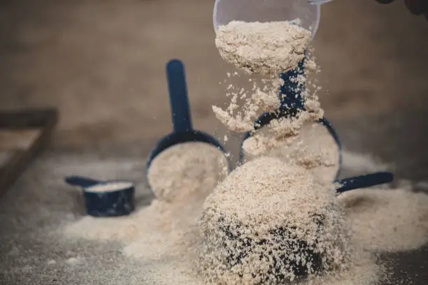 Photo of Closeup shot of the grain flour in the plastic scoops