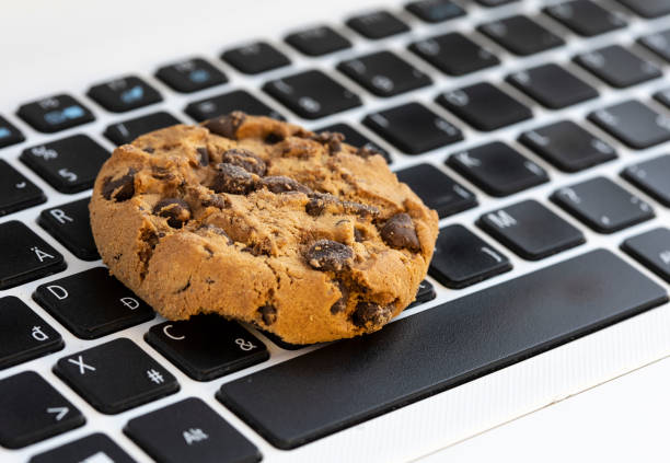 Chocolate on keyboard symbol of internet cookies