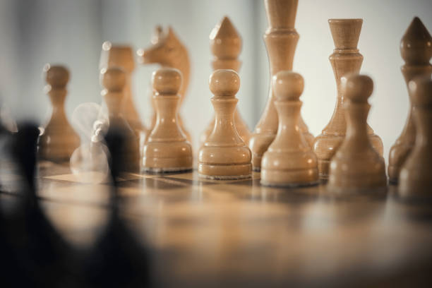 istock Wooden chess pieces on the chessboard. 1308301464