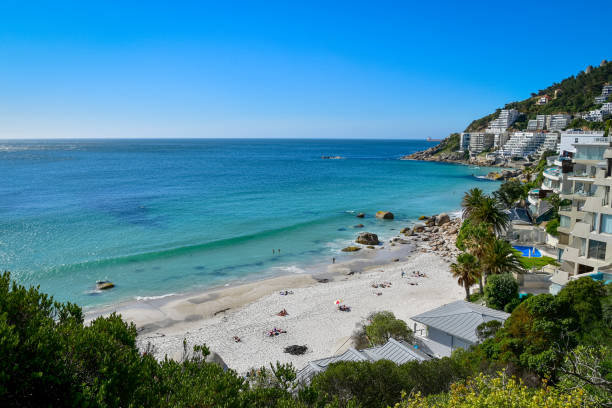 Sunny holiday at beach destination Clifton beach and coastline with appartement buildings and holiday resorts, Cape Town South Africa clifton stock pictures, royalty-free photos & images