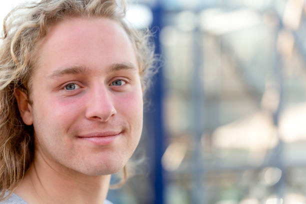 istock Portrait of modern, young man, front view, background with copy space 1308308210