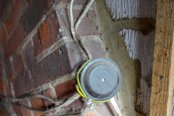 istock Inside of a roof void space with wires and insulation 1308309824