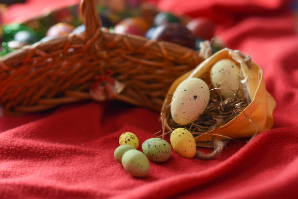 Basket full of Easter eggs on the red background