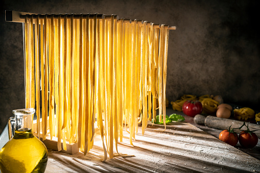 Homemade fresh pasta recipe fresh dough hanging to dry handmade drying