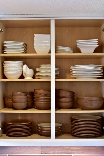 istock Open organized shelving in kitchen cabinets 1308313650